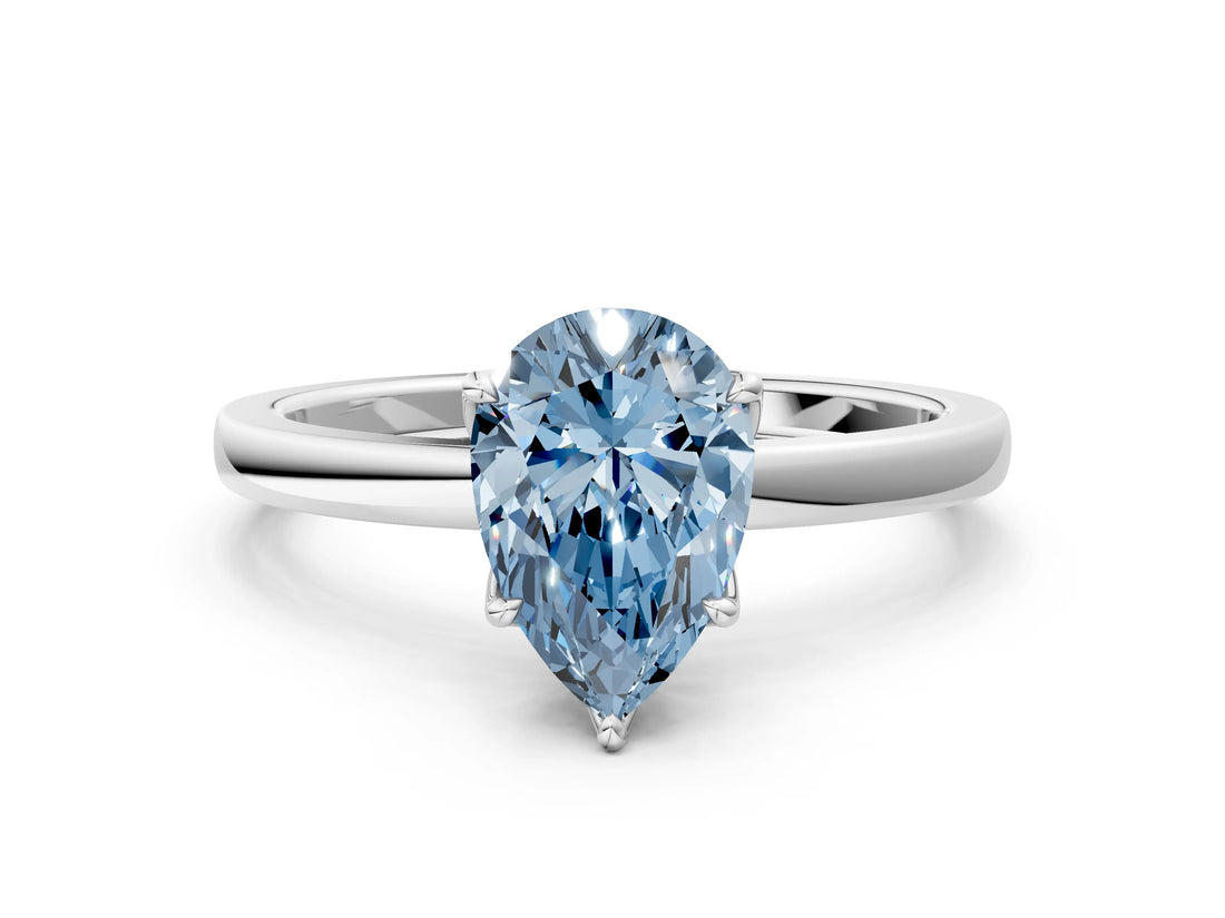 Silver Fancy Blue Pear Cut Diamond Solitaire Ring with Thin Band and Prong Setting