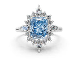 Silver Fancy Blue Radiant Cut Halo Diamond Cluster Ring with Marquise and Round Stones on a White Gold Band with Prong Setting