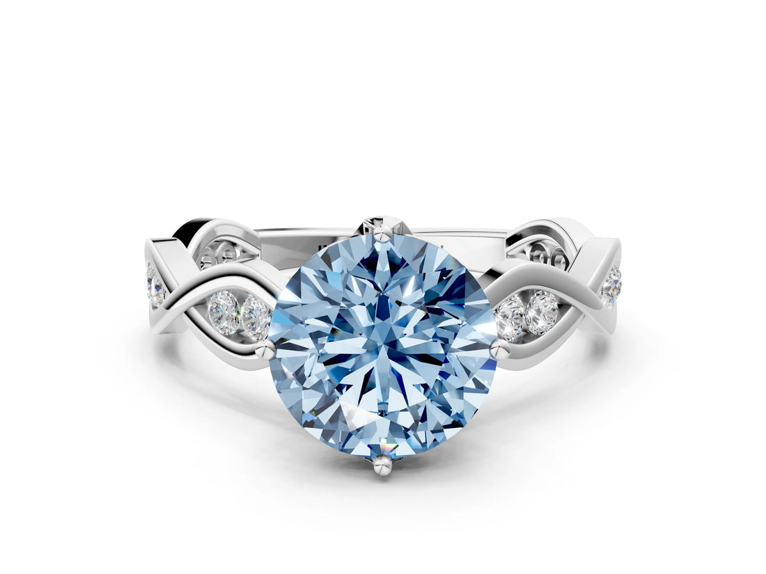 Silver Fancy Blue Round  Solitaire Twist Band with Leaf Prong Setting