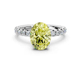 Silver Fancy Yellow Oval Cut Diamond Pavé Solitaire Ring with Round Band and Prong Setting