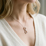 Silver Infinity Pendant with Round Brilliant Diamonds in Pavé Setting