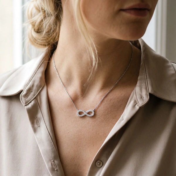 White gold Infinity Pendant with Round Diamond Pavé Setting