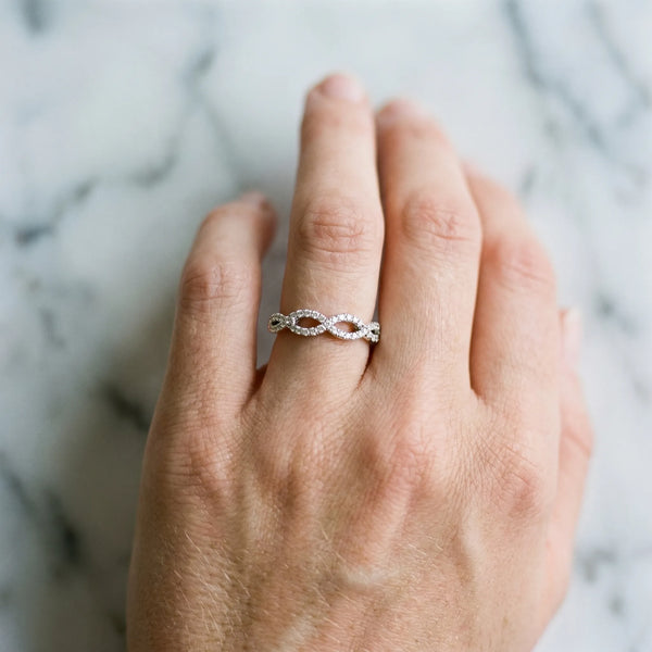 Platinum Infinity Twist Diamond Pavé Band with Round Stones and Prong Setting
