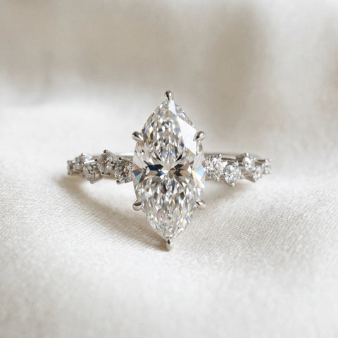 Silver 0.50 Carat D VVS2 Marquise Diamond Cluster Side Stone Solitaire Ring with Prong Setting