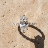 Silver Marquise Cut Diamond Ring with Marquise and Round  Side Stones and Four-Prong Setting