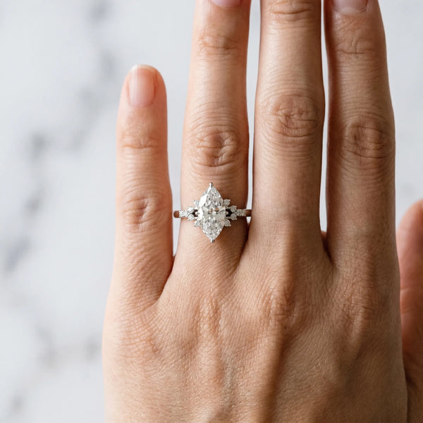 Silver Marquise Cut Diamond Ring with Side Stones and Four-Prong Setting