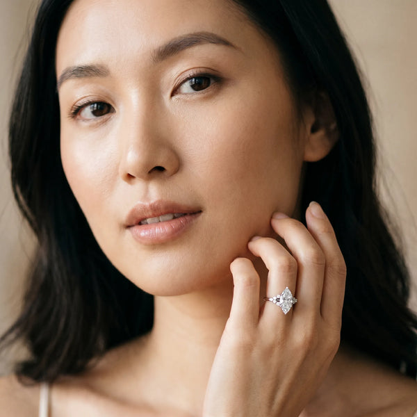 Silver Marquise Cut Diamond Ring with Side Stones and Four-Prong Setting