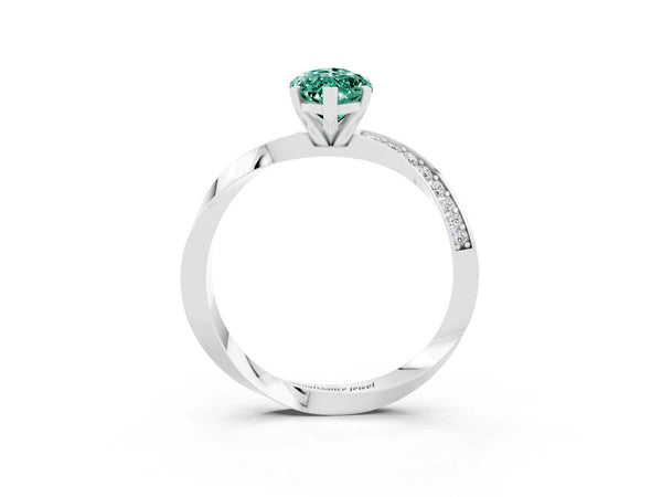 Silver Marquise Cut Green Sapphire Engagement Ring with Side Stone Accents and Four-Prong Setting