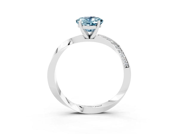 Silver Oval Cut Aquamarine Engagement Ring with Side Stone Accents and Four-Prong Setting