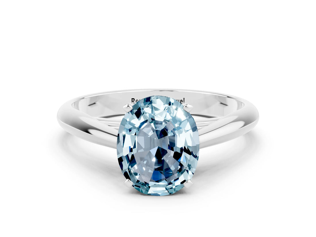 Silver Oval Cut Aquamarine Solitaire Engagement Ring with Cathedral Setting and Four-Prong Mount