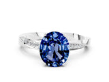 Silver Oval Cut Blue Sapphire Engagement Ring with Side Stone Accents and Four-Prong Setting_12