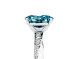 Silver Oval Cut Blue Topaz Engagement Ring with Side Stone Accents and Four-Prong Setting_17