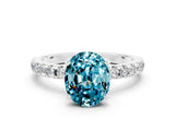 Silver Oval Cut Blue Topaz Solitaire Ring with Round  Pavé Band and Four-Prong Setting_24