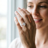 Silver Oval Cut Diamond Brilliant Solitaire Ring with Pavé Band and Four-Prong Setting