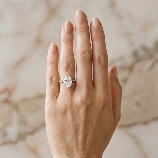 White gold Oval Cut Diamond Solitaire Ring with Round  Pavé Band and Prong Setting