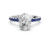 Silver Oval Cut Diamond Solitaire Ring with Round with Blue Sapphire side stone Pavé Band and Four-Prong Setting_12