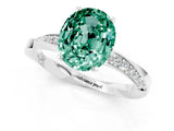 Silver Oval Cut Green Sapphire Engagement Ring with Side Stone Accents and Four-Prong Setting_13