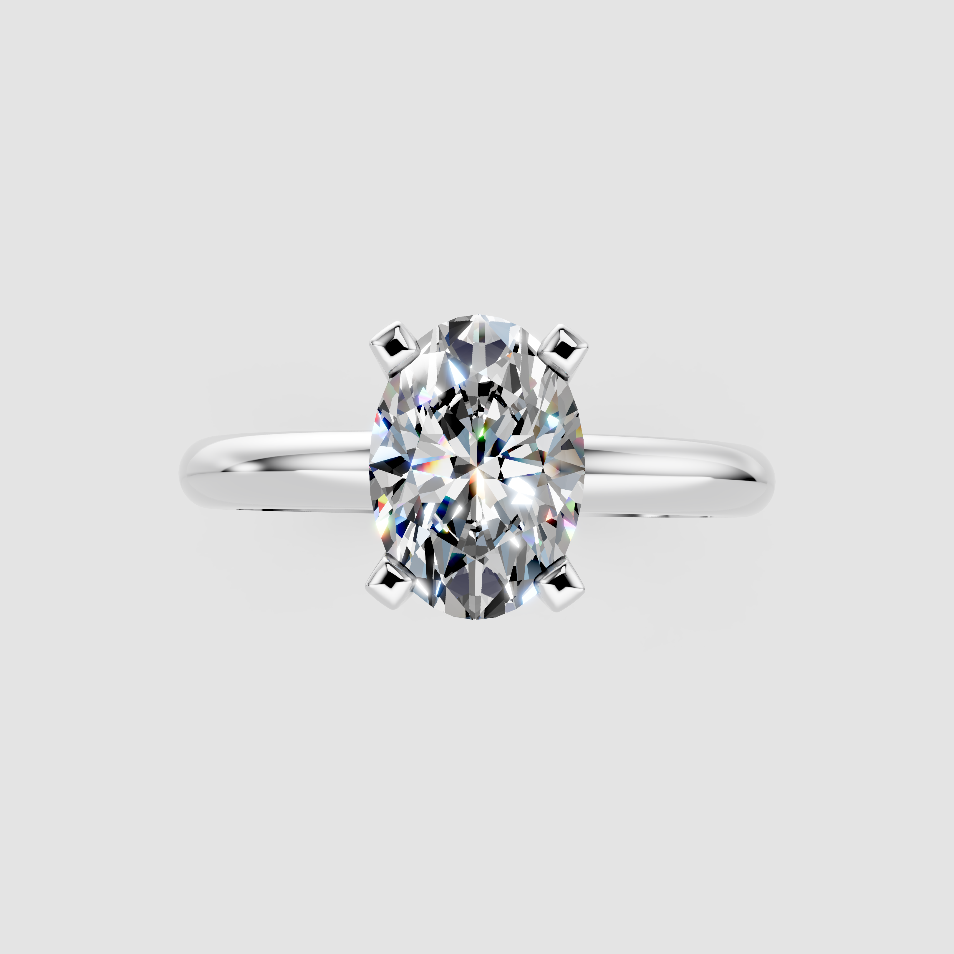 Silver Oval Cut Solitaire Engagement Ring with Round Band and Four-Prong Setting