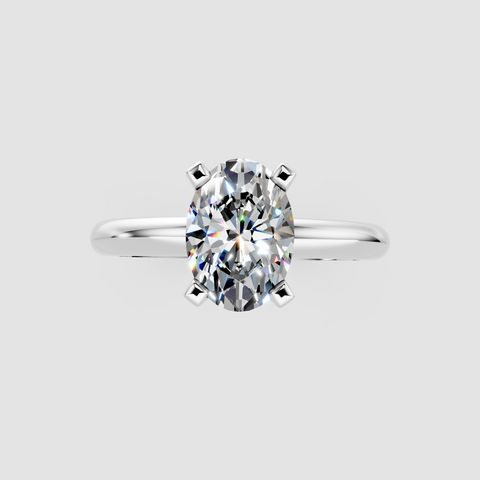 Silver Oval Cut Solitaire Engagement Ring with Round Band and Four-Prong Setting