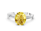 Silver Oval Cut Yellow Sapphire Engagement Ring with Side Stone Accents and Four-Prong Setting_12