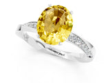 Silver Oval Cut Yellow Sapphire Engagement Ring with Side Stone Accents and Four-Prong Setting_13