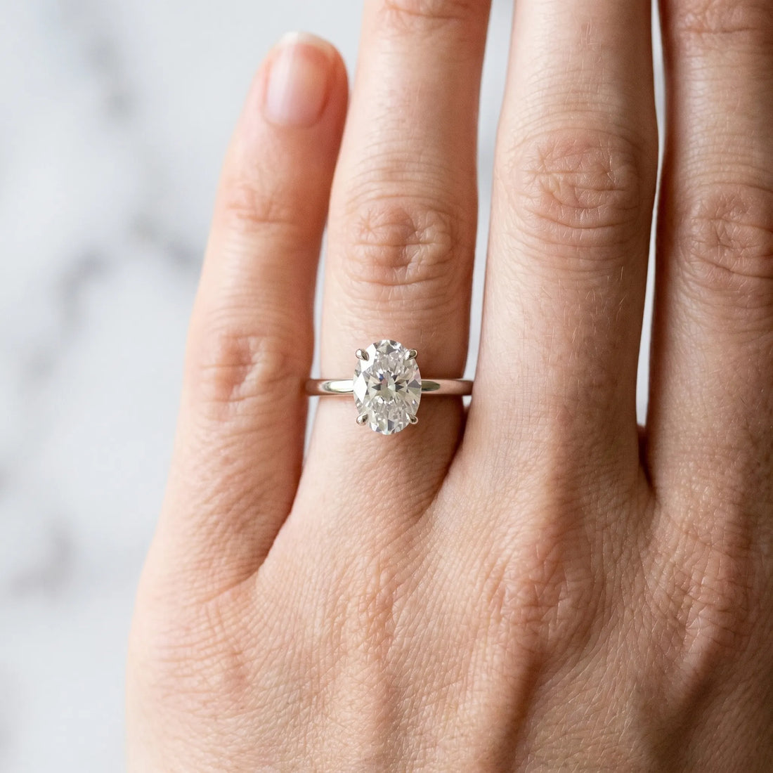 Silver Oval Diamond Solitaire Ring with Slim Band and Four-Prong Setting_21
