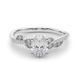 Silver Oval Solitaire Leaf-Inspired Diamond Ring with Pavé Band and Four-Prong Setting
