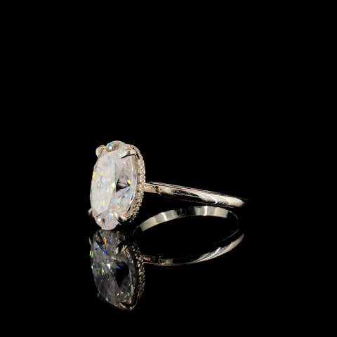 Silver Oval Solitaire Ring with Four-Prong Setting on a Classic Band