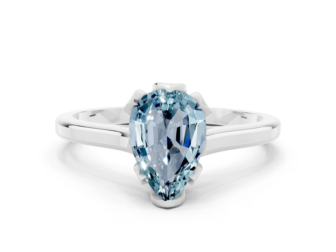 Silver Pear Cut Aquamarine Solitaire Ring with Flower Prong Setting and Classic Band