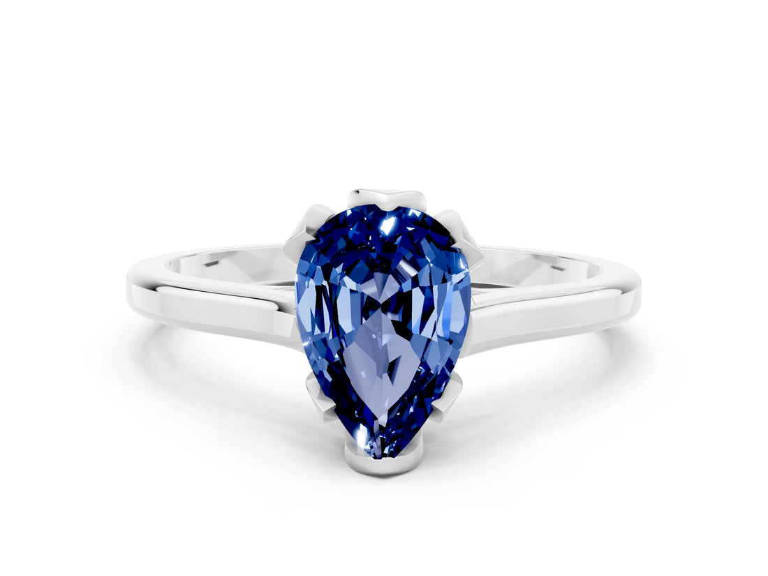 Silver Pear Cut Blue Sapphire Solitaire Ring with Flower Prong Setting and Classic Band