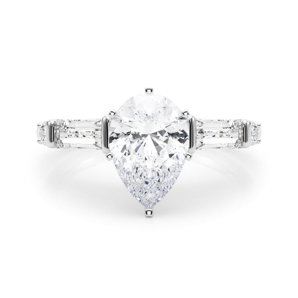 Silver Pear Cut Diamond Ring with Baguette Side Stones, Channel Set Band, and Four-Prong Setting