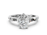 Silver Pear Cut Diamond Ring with Baguette Side Stones, Channel Set Band, and Four-Prong Setting_33