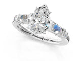 Silver Pear Cut Diamond Ring with Baguette Side Stones, Channel Set Band, and Four-Prong Setting_34