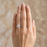 Silver Pear Cut Diamond Ring with Marquise and Round  Side Stones and Four-Prong Setting