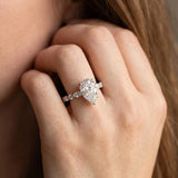 Silver Pear Cut Diamond Ring with Marquise and Round  Side Stones and Four-Prong Setting