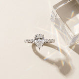 Silver Pear Cut Diamond Ring with Marquise and Round  Side Stones and Four-Prong Setting