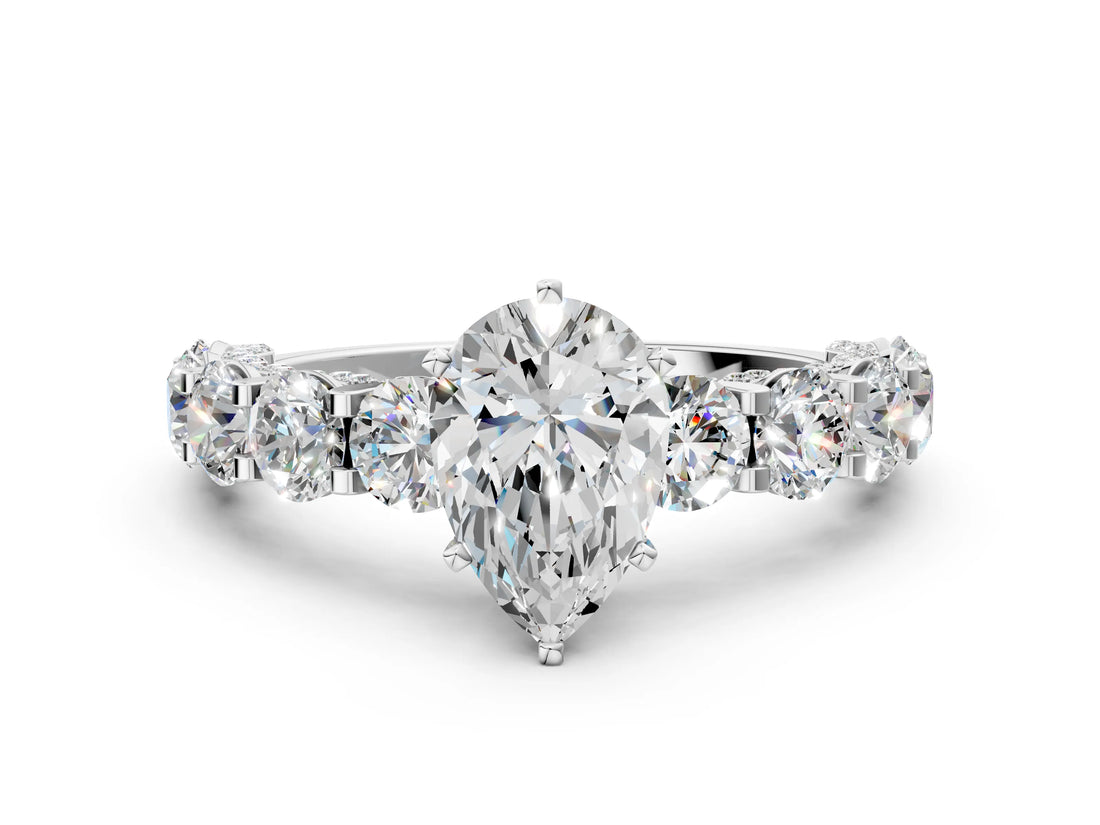 Silver Pear Cut Diamond Side Stone Engagement Ring with Four-Prong Setting