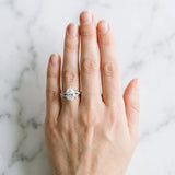 Silver Pear Cut Diamond Solitaire Engagement Ring with Twisted Pavé Band and Four-Prong Setting_76