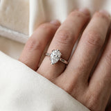 Silver Pear Cut Diamond Solitaire Ring with Flower Prong Setting and Classic Band
