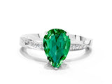 Silver Pear Cut Emerald Engagement Ring with Side Stone Accents and Four-Prong Setting_12