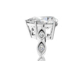 Silver Pear Cut Solitaire Diamond Ring with Infinity Twist Band and Four-Prong Setting_18