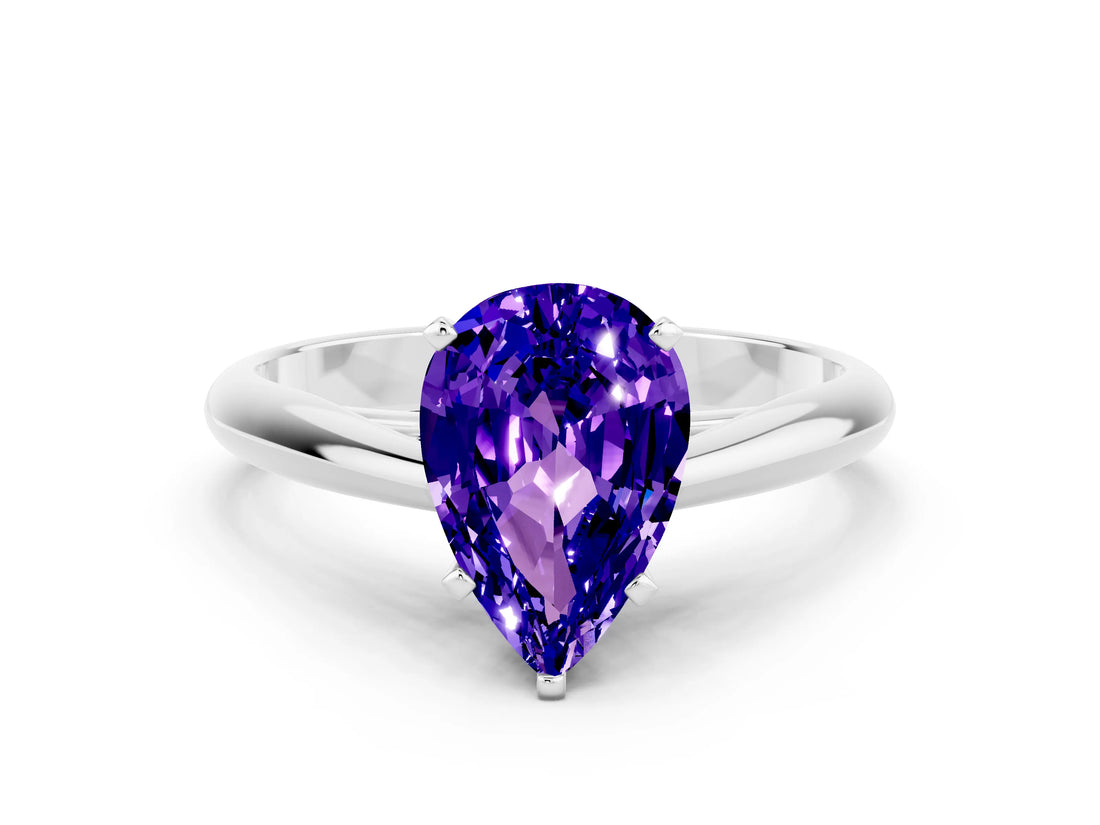 Silver Pear Cut Tanzanite Solitaire Engagement Ring with Cathedral Setting and Four-Prong Mount