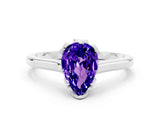 Silver Pear Cut Tanzanite Solitaire Ring with Flower Prong Setting and Classic Band