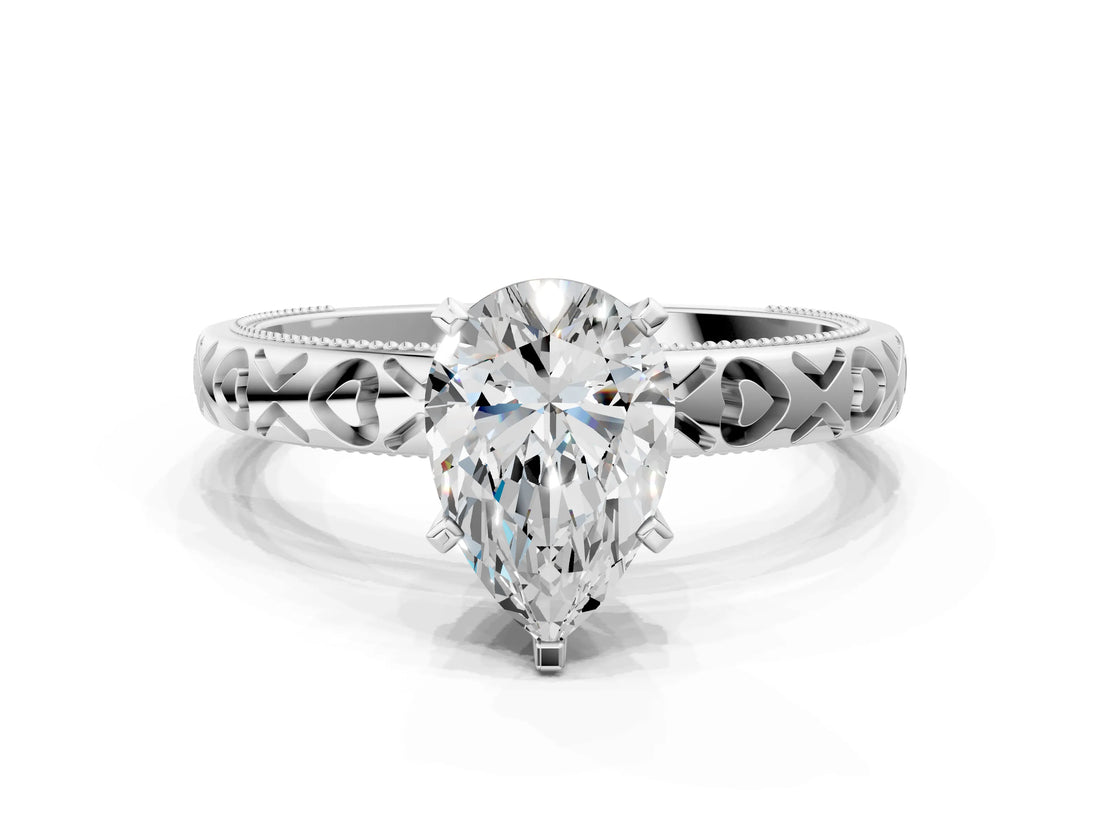 Silver Pear Solitaire Diamond Engagement Ring with XO Engraved Band and Four-Prong Setting