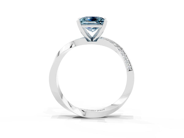 Silver Princess Cut Aquamarine Engagement Ring with Side Stone Accents and Four-Prong Setting