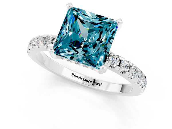 Silver Princess Cut Blue Topaz Solitaire Ring with Round Pavé Band and Four-Prong Setting