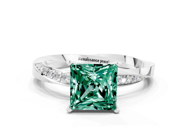 Silver Princess Cut Green Sapphire Engagement Ring with Side Stone Accents and Four-Prong Setting