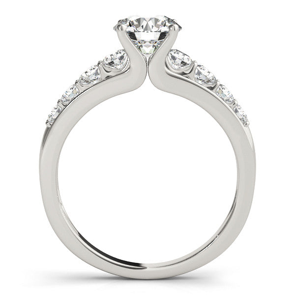 Silver Round Brilliant Solitaire with Side Stones on a Pave Band and Four-Prong Setting 1