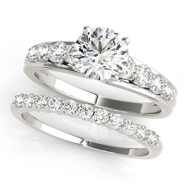 Silver Round Brilliant Solitaire with Side Stones on a Pave Band and Four-Prong Setting