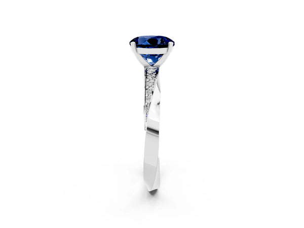Silver Round Cut Blue Sapphire Engagement Ring with Side Stone Accents and Four-Prong Setting